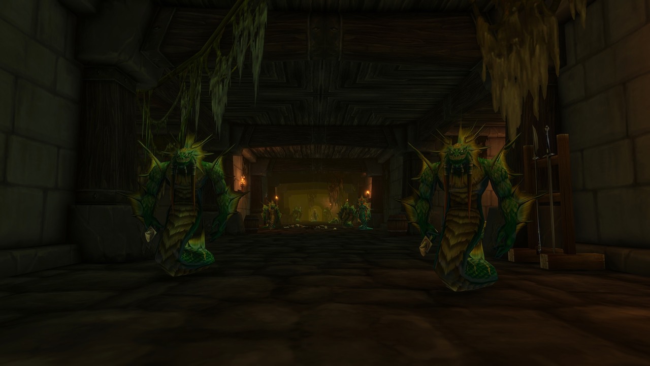 Two naga in a stone dungeon corridor